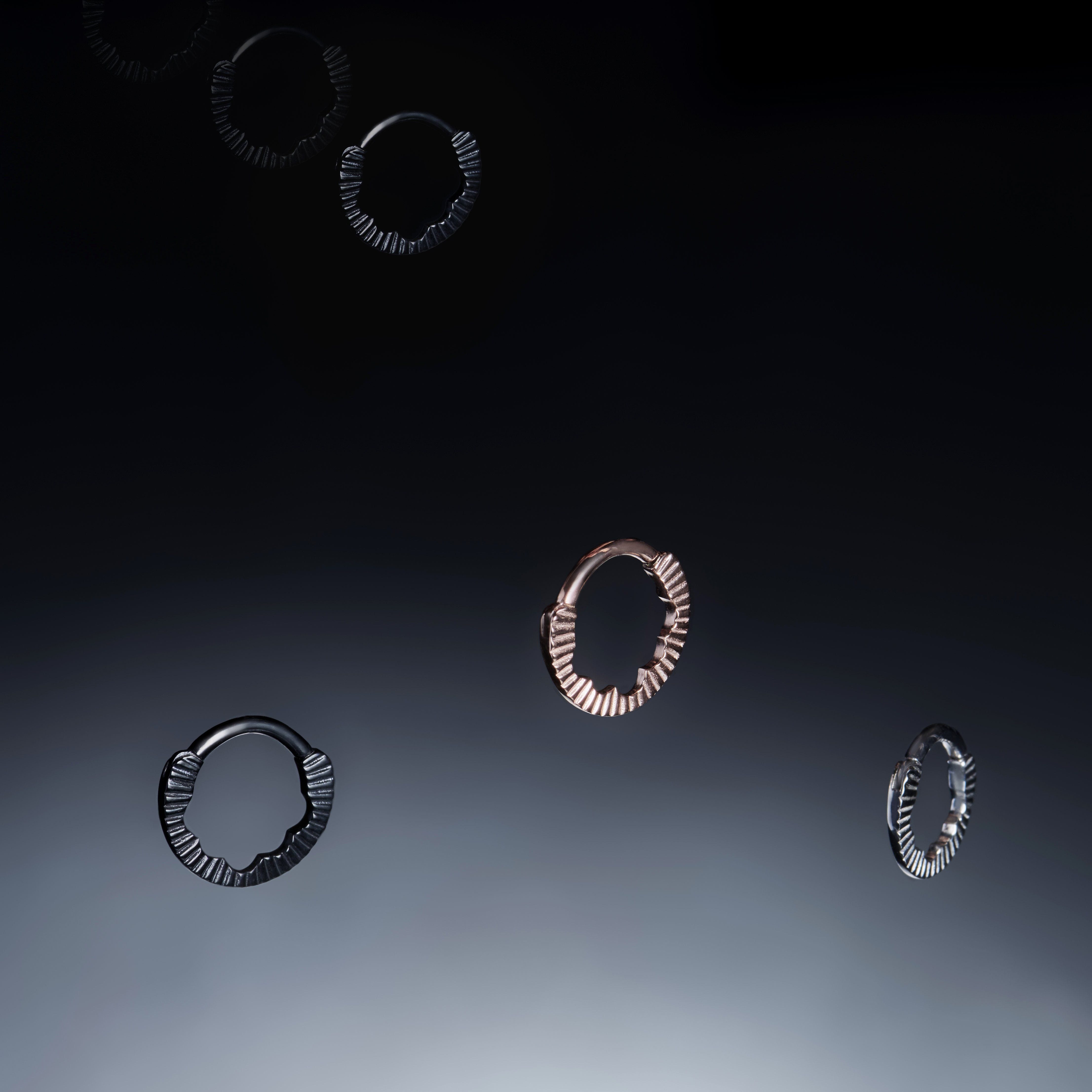 aether septum ring collection in gold, black and silver